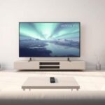 A minimalist Scandinavian living room featuring a 4K television showcasing a Nordic landscape with the text "NORDISK IPTV" as a watermark.