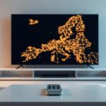 Nordic countries interconnected on a TV screen, representing IPTV, with a remote on a table in a modern living room.