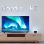 Modern Nordic interior featuring a smart TV displaying the Northern Lights, symbolizing Nordisk IPTV.