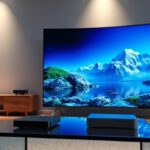 Premium IPTV service illustration featuring a curved OLED TV displaying 4K content in a modern living room setting.